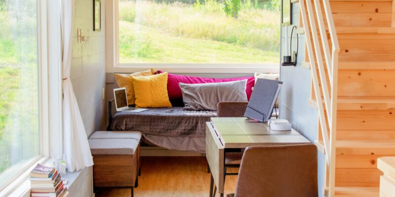 brown wooden framed white padded couch