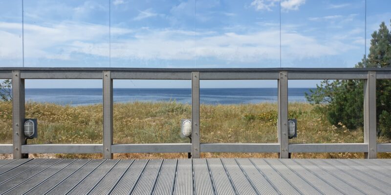 gray wooden dock under cloudy sky during daytime