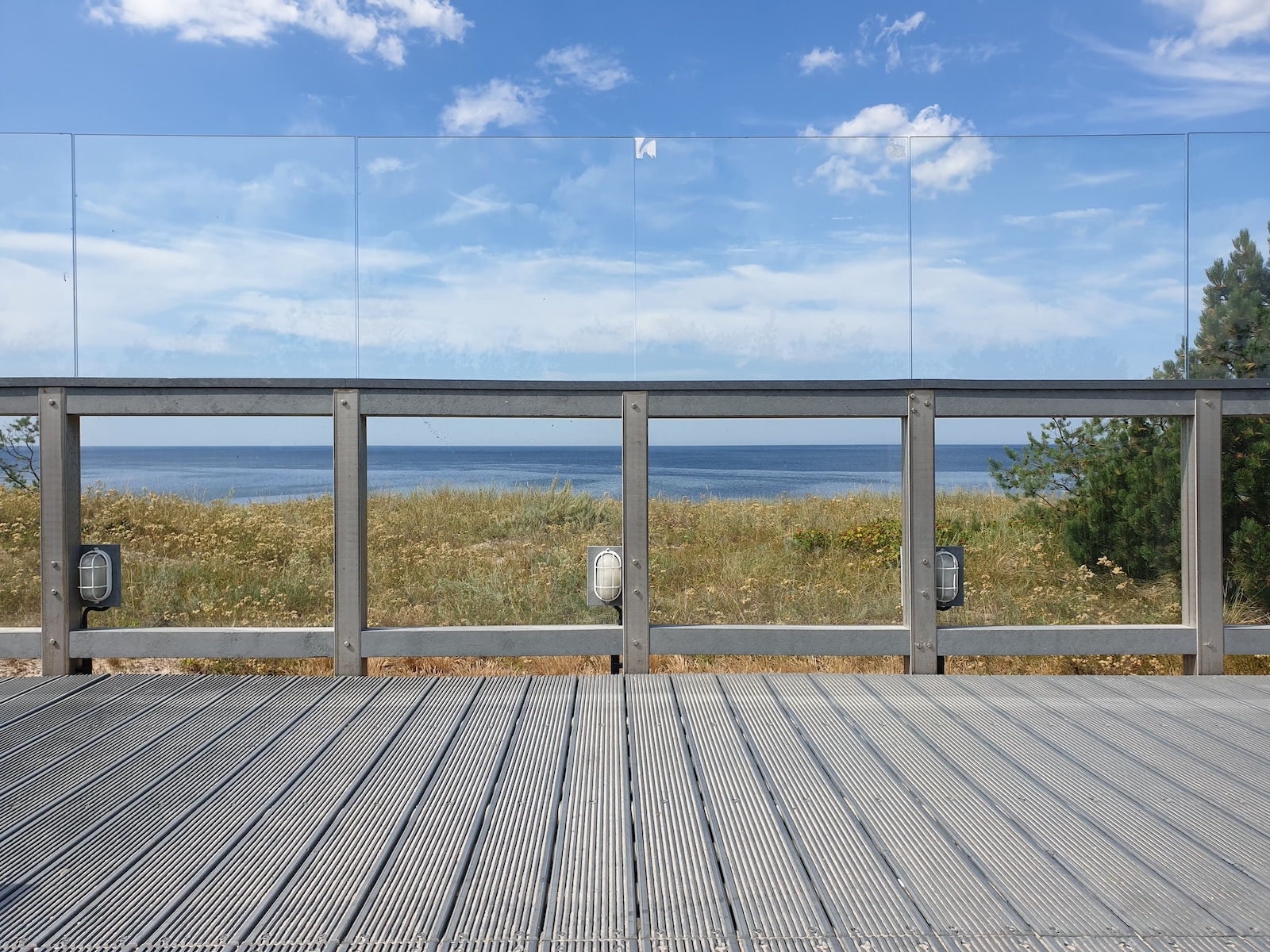 gray wooden dock under cloudy sky during daytime